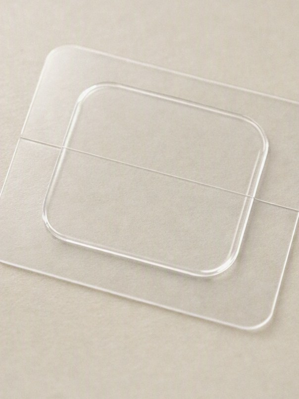 Clear square estradiol patch on its backing